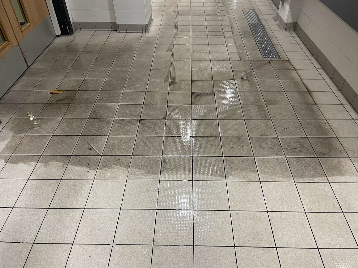 Body fats, dirt, grease and grime being removed from Oldham swimming baths floor as hardfloor restoration use there Commercial Cleaning Services