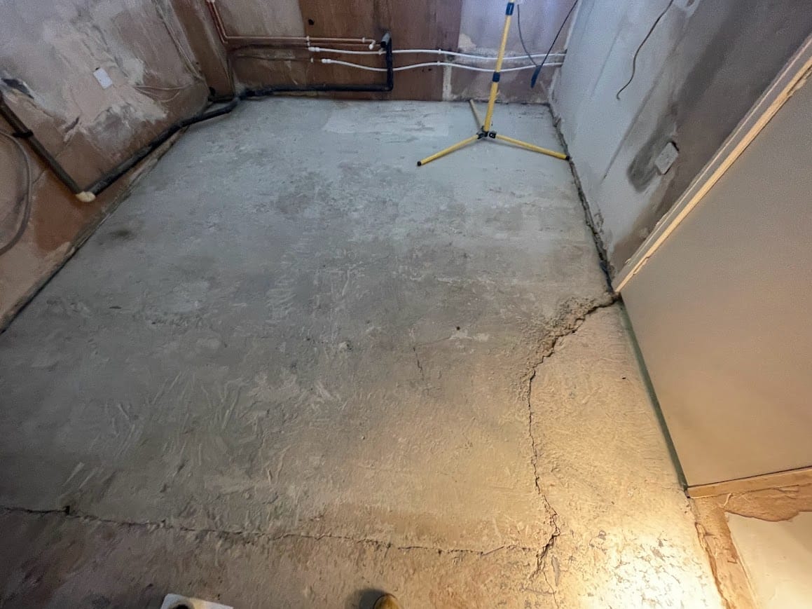 Before image of a concrete floor before being tiled with Limestone Tiles. manchester tiling service